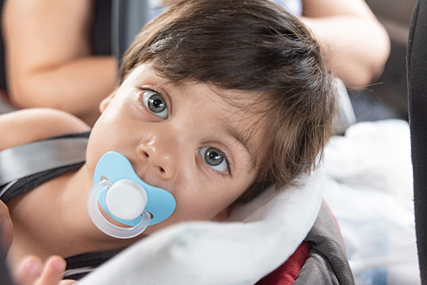 baby-boy-with-blue-eyes-sitting-baby-seat-600w